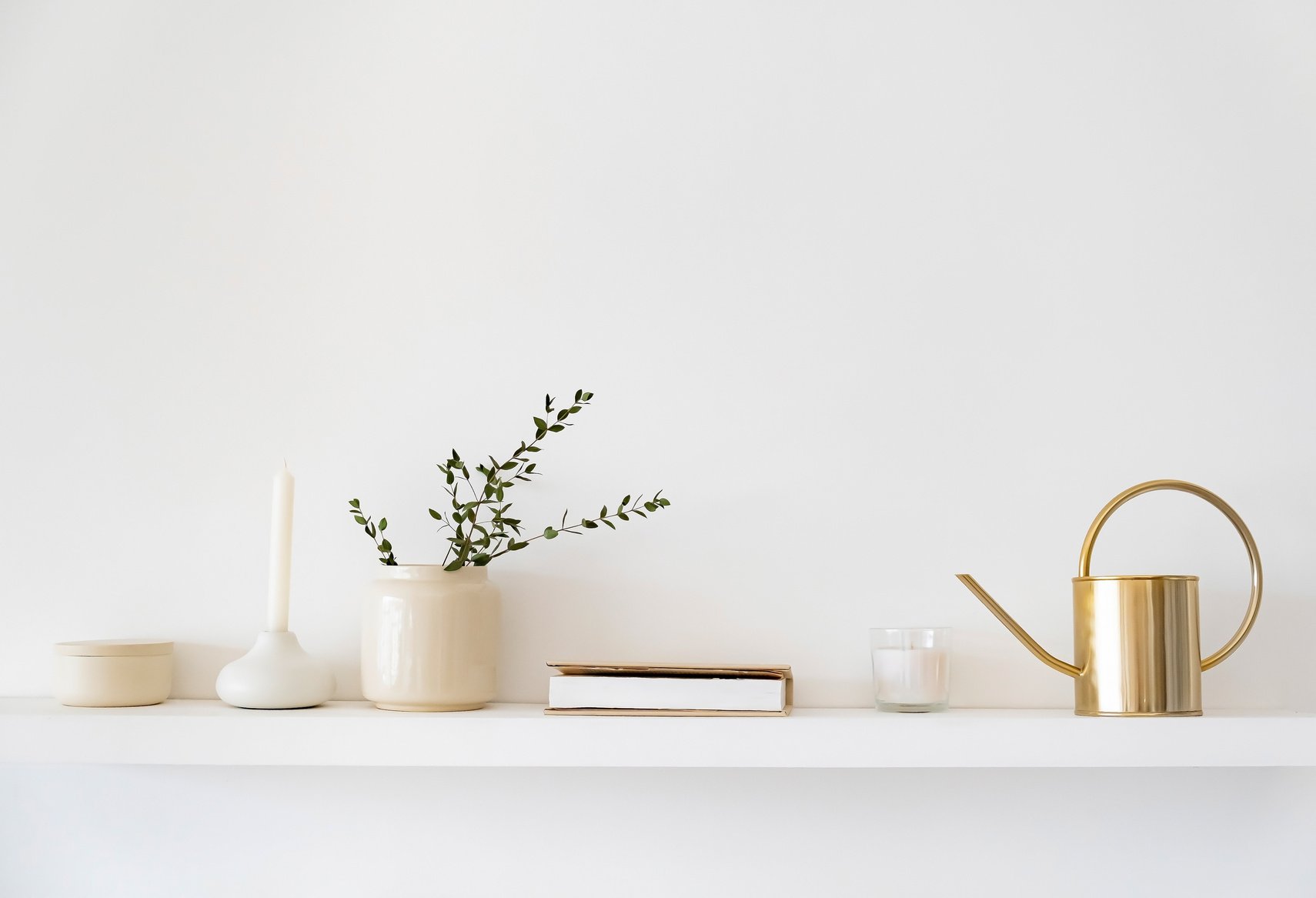 Minimalistic Scandinavian interior. Dishes on white shelves.